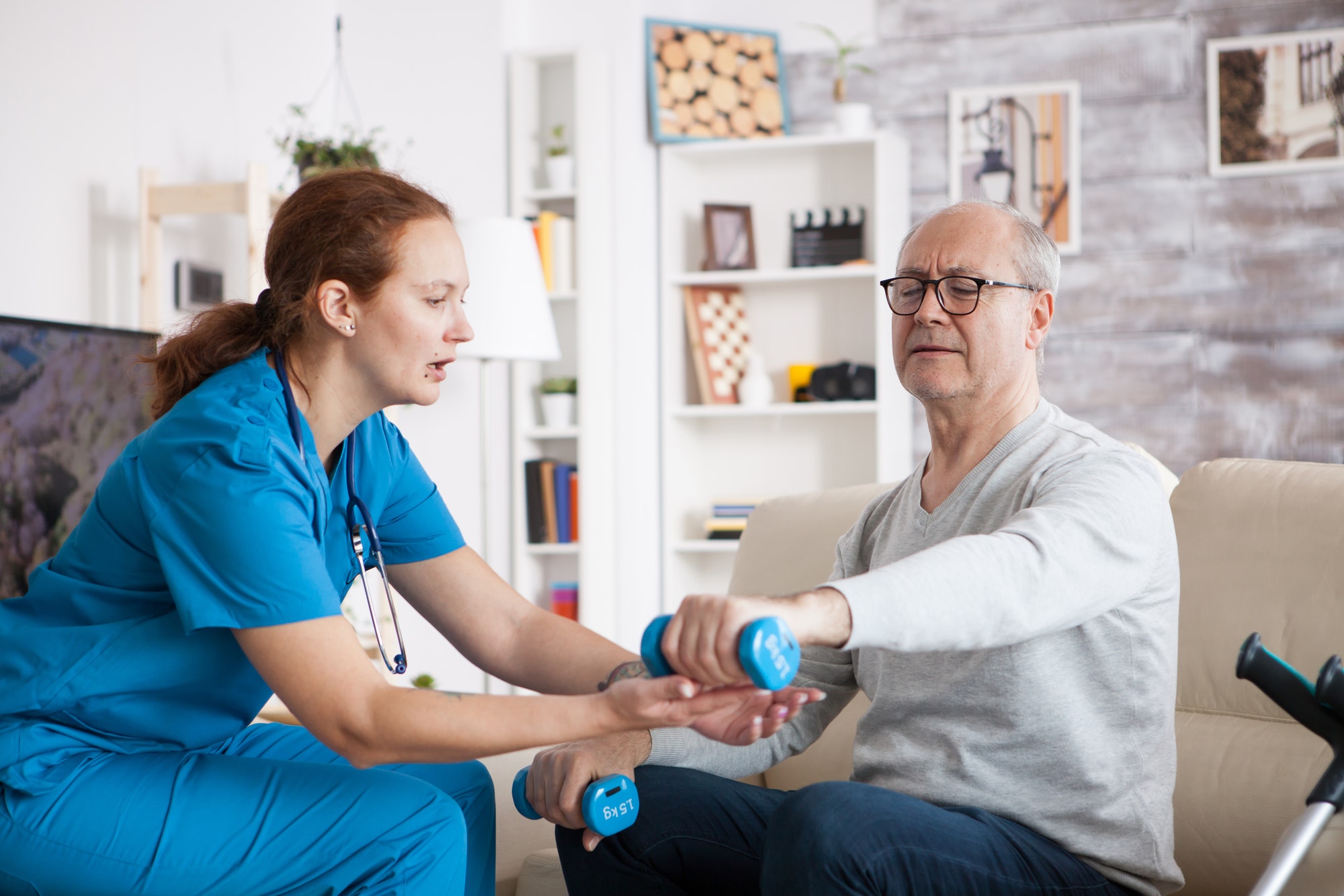 senior man in nursing home doing physiotherapy